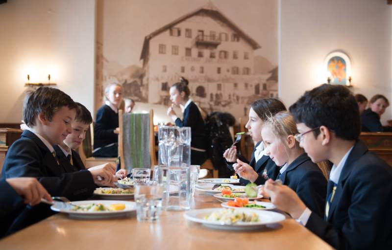Students having lunch at a traditional Austrian restaurant near St. Gilgen International Day and Boarding School