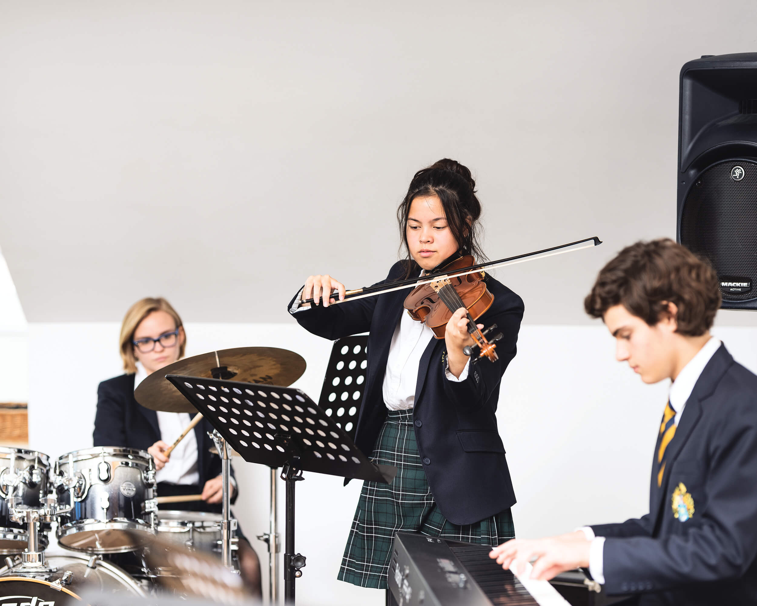 Students in music class at St. Gilgen International Day and Boarding School