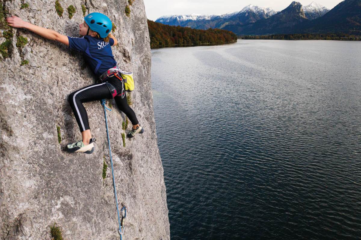 Student climbing with a view of Wolfgangsee in the Austrian Alps