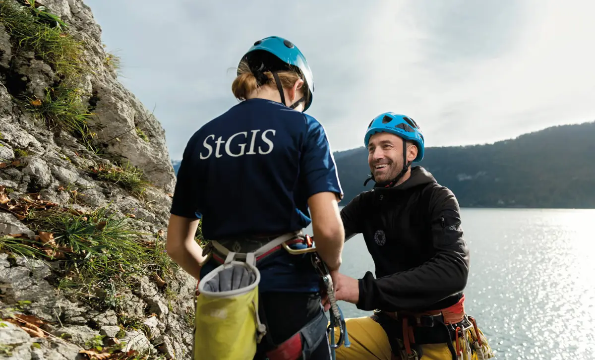 Student and teacher climbing near Wolfgangsee in the Austrian Alps