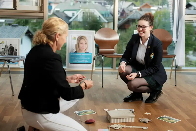 Student and teacher conversation at St. Gilgen International Boarding School