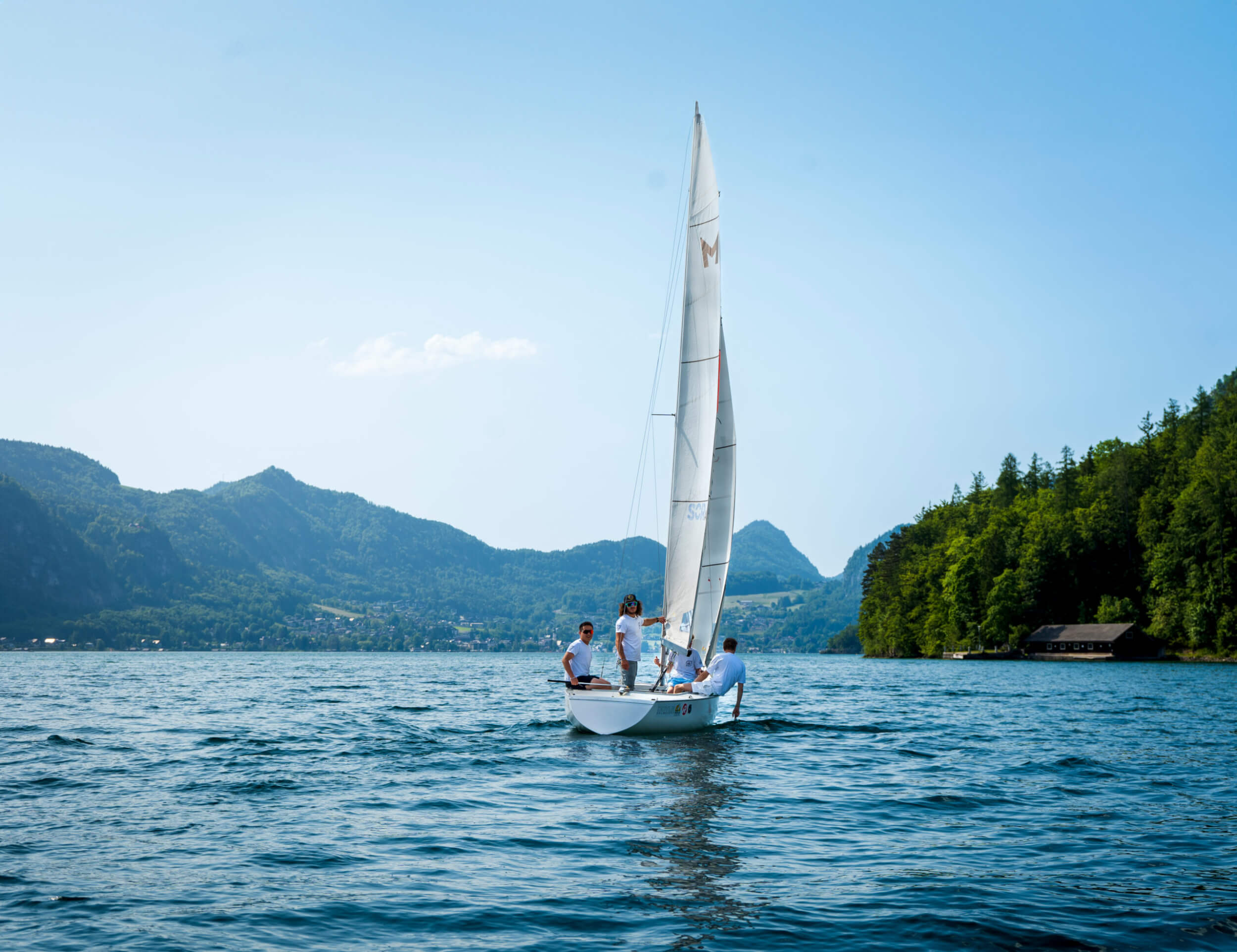 Campers sailing on an Austrian lake near the school