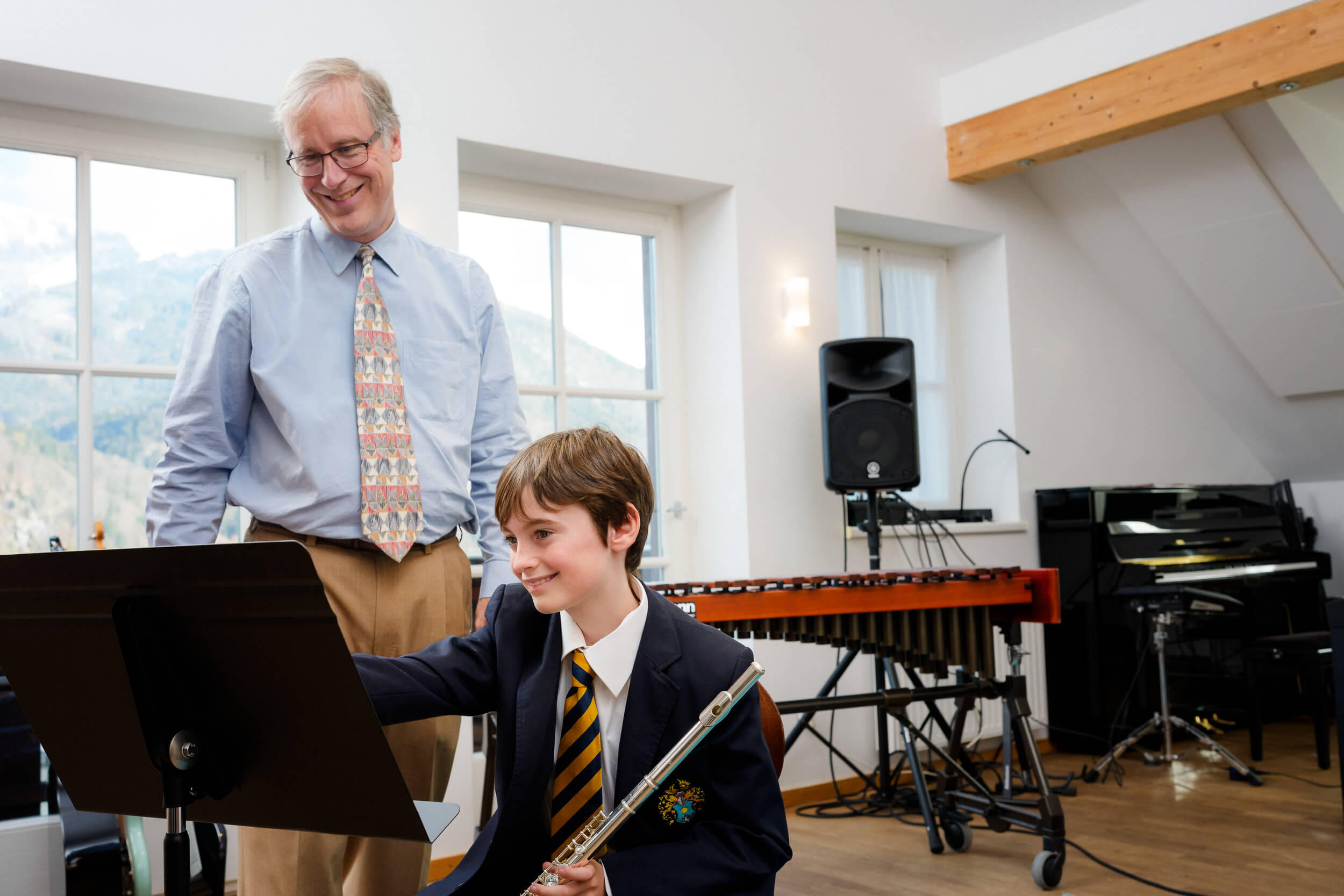 Primary student in music class at St. Gilgen International Boarding School